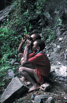 Herowana boys with binoculars