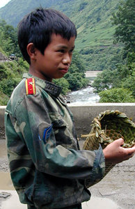Local fisherman with bamboo fishing trap